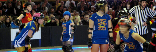 Jammers skating through the pivots and blockers … Queen City Roller Girls